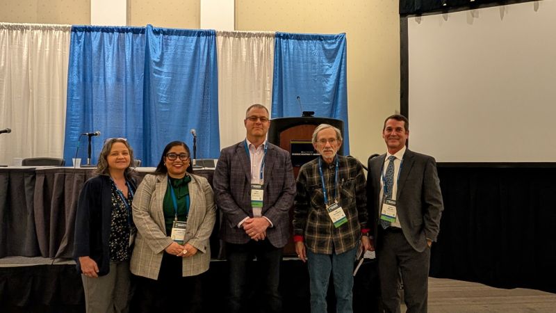 Group Photo of Katrina Waters,PhD, Arpana Vaniya, PhD, Thomas Metz, PhD, Aristides Patrinos PhD, and Gary Miller, PhD at the AAAS conference.